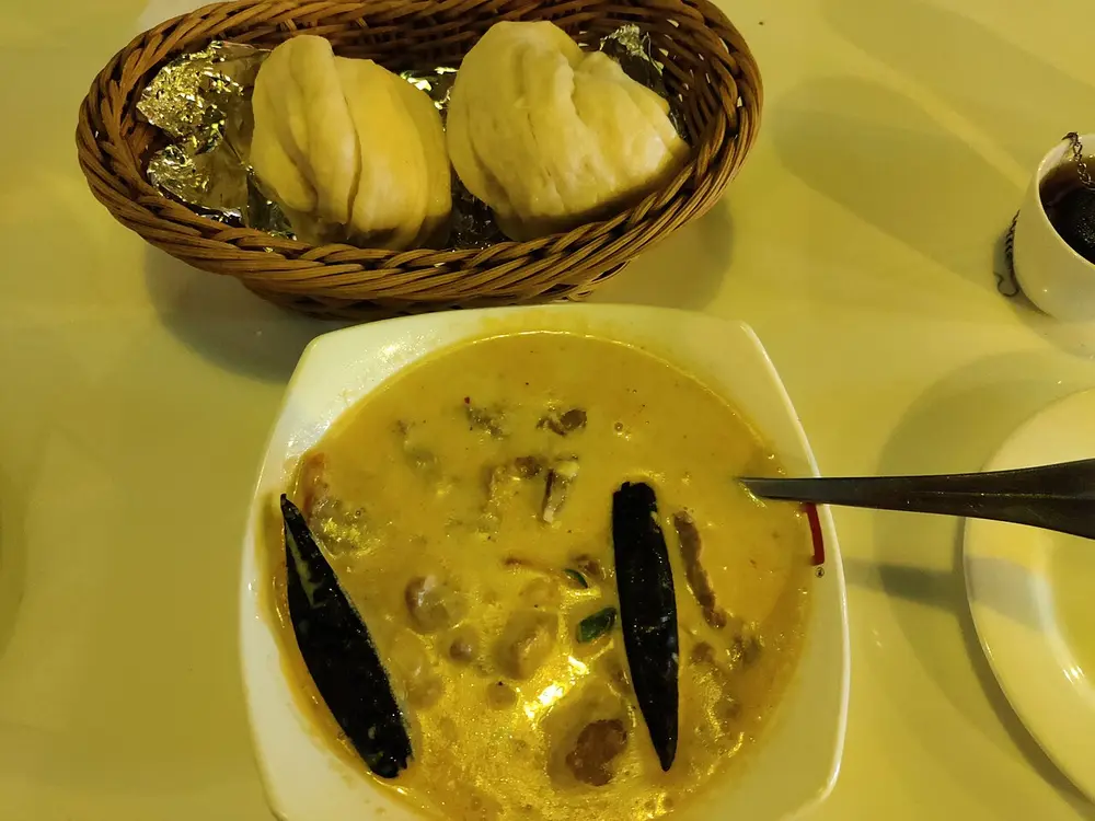 Ema datshi, chillies in cheese, with steamed bread